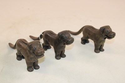 Lot 1043 - Three vintage nutcrackers in the form of dogs.