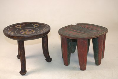 Lot 1071 - An African Tribal Stool raised on three legs...