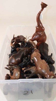 Lot 1053 - A large collection of African carved animals,...