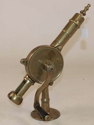 Lot 1002 - A brass table mounted 'Eclipse' bar corkscrew,...