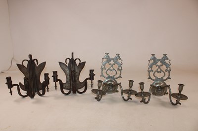 Lot 1205 - A pair of Arts and Crafts wrought metal three...