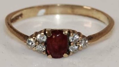 Lot 398 - A 9ct yellow gold ruby and diamond dress ring...