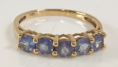 Lot 388 - An 18ct yellow gold five stone tanzanite dress...