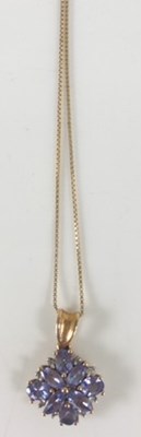 Lot 404 - A 9ct yellow gold tanzanite pendant on 10ct...
