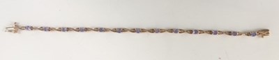 Lot 373 - A 9ct yellow gold and tanzanite bracelet,...
