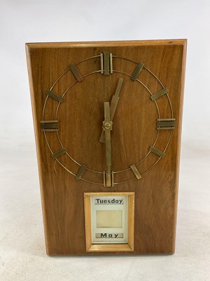 Lot 653 - An Art Deco walnut and light oak self-winding...