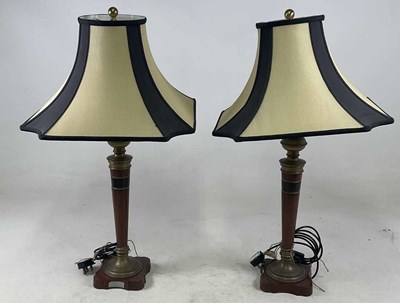 Lot 490 - A pair of Art Deco inspired walnut brass...