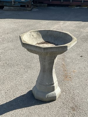 Lot 2338 - A composite octagonal bird bath, height 66cm.
