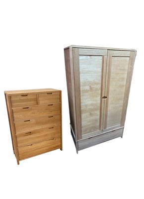 Lot 2306 - ERCOL; a modern light oak wardrobe and chest,...