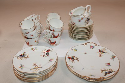Lot 164 - ROYAL DOULTON; a bird and floral decorated tea...
