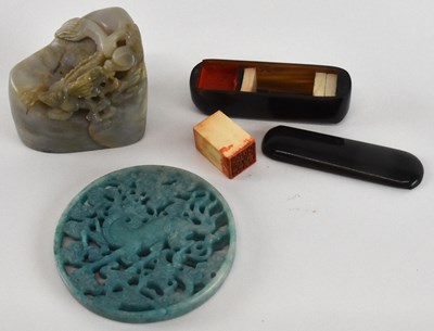 Lot 593 - A Chinese carved hardstone figure of a dragon...