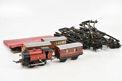Lot 612 - HORNBY; a part clockwork train set including a...