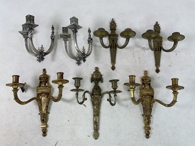 Lot 1208 - A pair of silvered metal twin branch wall...