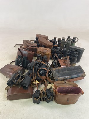 Lot 1102 - A large collection of binoculars and field...