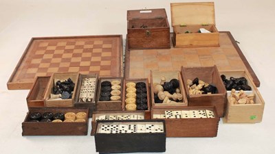 Lot 1025 - A collection of various chess pieces, draught...