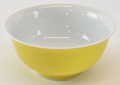 Lot 582 - A Chinese yellow ground porcelain shallow bowl,...