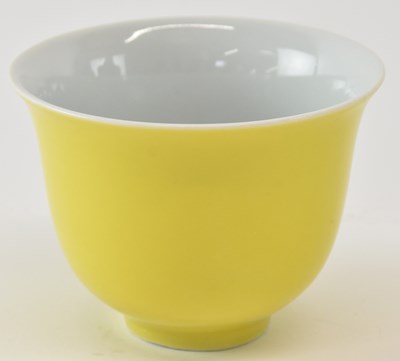Lot 595 - A Chinese yellow ground porcelain tea bowl,...