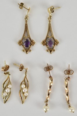 Lot 1261 - Three pairs of 9ct gold earrings comprising...