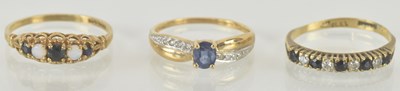 Lot 1191 - Three 9ct gold dress rings comprising a...