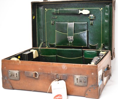 Lot 321 - A Finnegans Ltd vintage leather suitcase with...