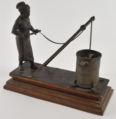 Lot 653 - A Cambodian Khmer bronze of a well worker,...