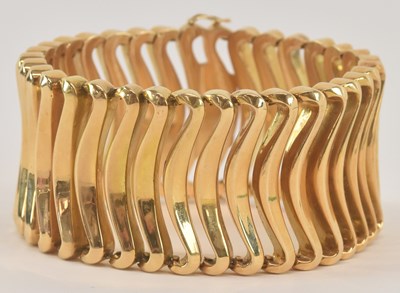 Lot 1303 - An 18ct yellow gold chunky wide bracelet,...