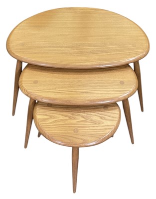 Lot 10 - ERCOL; a mid century nest of three medium elm '...
