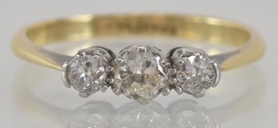 Lot 1175 - An 18ct yellow gold diamond set three stone...