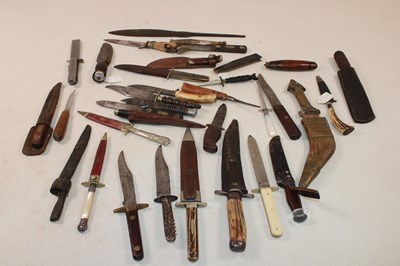 Lot 113 - A large collection of knives and daggers, some...