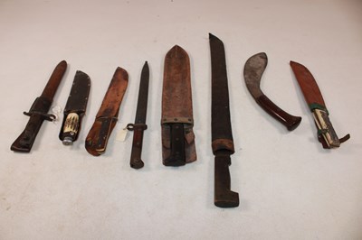 Lot 115 - Two bayonets with scabbards, a large Borneo...