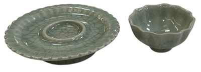 Lot 590 - A Chinese celadon glazed Longquan tea bowl and...