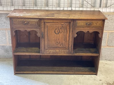 Lot 545 - An oak Art Nouveau cupboard with a single door...