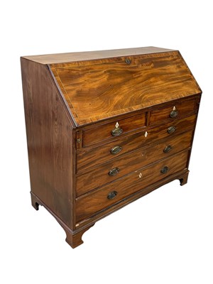 Lot 2128 - A Georgian crossbanded mahogany bureau, the...