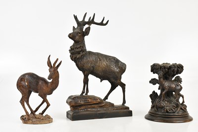 Lot 1259 - BLACK FOREST; a carved stand representing a...
