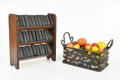 Lot 454 - A miniature oak three tier bookshelf, housing...
