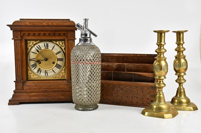 Lot 1308 - An early 20th century oak mantel clock with...