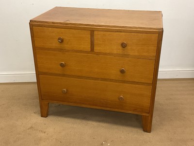 Lot 544 - A mid 20th century light oak chest of two...