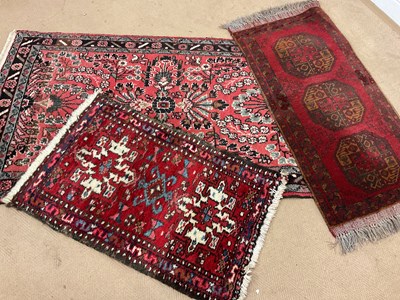 Lot 501 - Three various Persian rugs, largest 153 x 82cm.