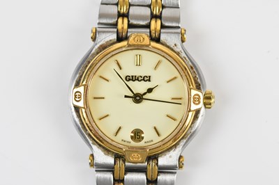 Lot 1671 - GUCCI; a lady's gold plated and stainless...