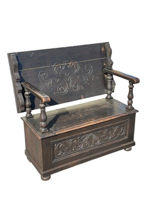 Lot 2107 - An early 20th century carved oak monk's bench,...