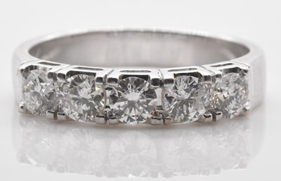 Lot 455 - An 18ct white gold five stone diamond ring set...