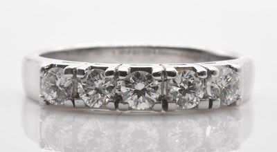Lot 458 - An 18ct white gold five stone diamond ring set...