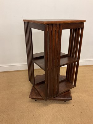 Lot 784 - A teak revolving bookcase, height 80cm, width...