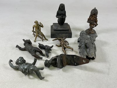 Lot 1136 - A group of metal figures including a humorous...