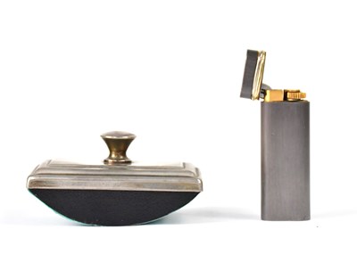 Lot 669 - CARTIER; a brushed steel lighter with...