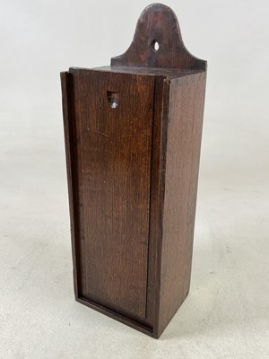 Lot 1066 - A George III oak candle box of rectangular...