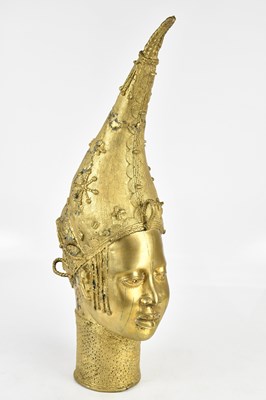Lot 1401 - A large gilt Benin bronze bust representing...