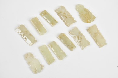 Lot 45 - Twelve small Chinese carved jade panels,...