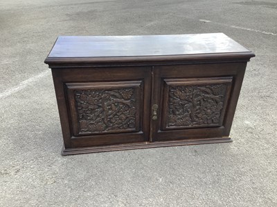 Lot 2177 - An early 20th century oak two door cupboard,...