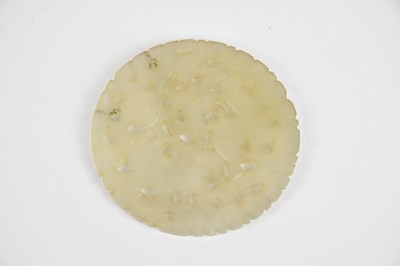 Lot 77 - A Chinese hardstone circular panel, decorated...